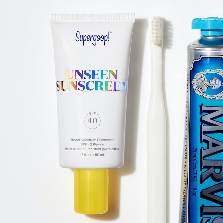 Supergoop! Unseen Sunscreen next to toothbrust and toothpaste with the concept of SPF as a daily routine, by Supergoop Founder Holly Thaggard