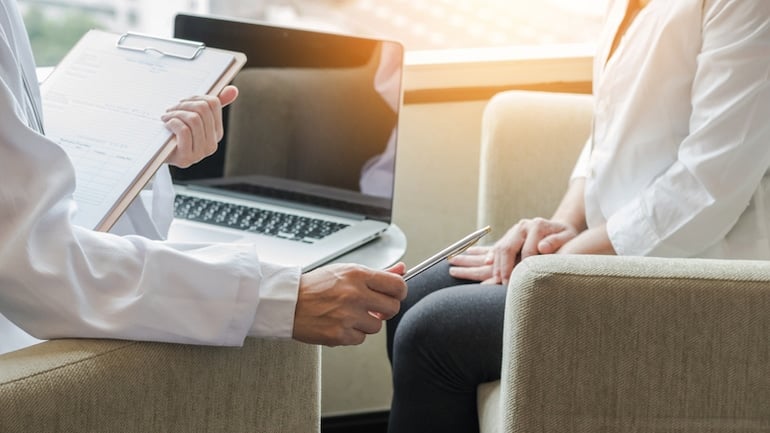 Woman consulting her doctor to see if vitex can help with fertility