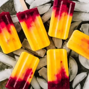 Fruit popsicle recipe made with beauty-boosting mango, raspberry, and coconut milk