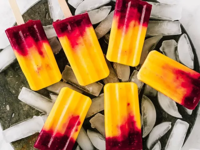 Fruit popsicle recipe made with beauty-boosting mango, raspberry, and coconut milk