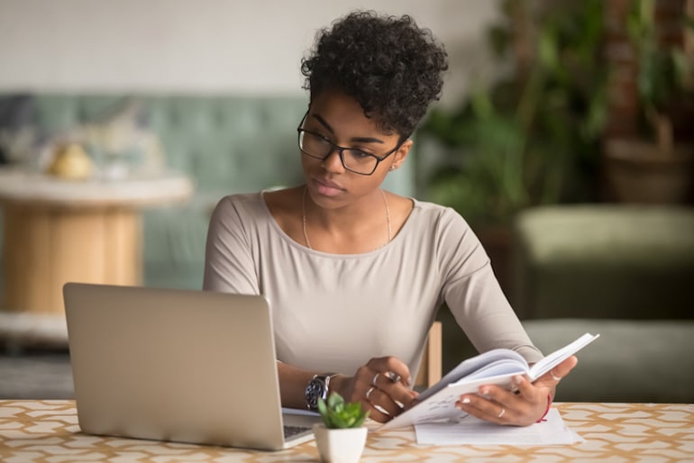 Woman focused at work at home office, busting the intermittent fasting myth that fasting saps energy and focus