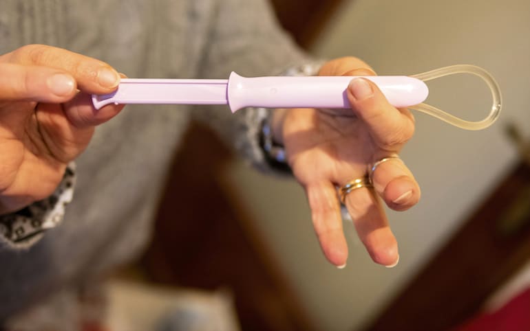 Woman holding a vaginal ring as one of the best types of birth control