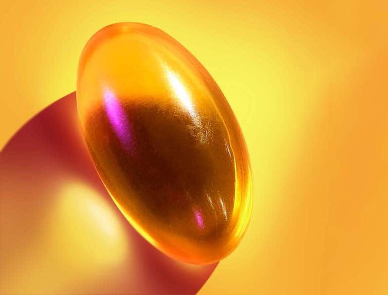 Vegan vitamin D supplement Here Comes the Sun on yellow background