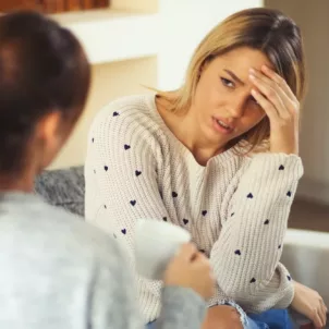 Woman exemplifying toxic positivity to upset friend