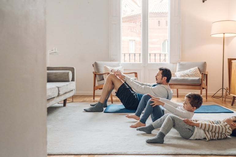 Father with children doing ab exercises