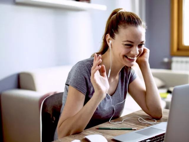 Woman having a video nutrition consultation, prepared with questions to ask a dietitian