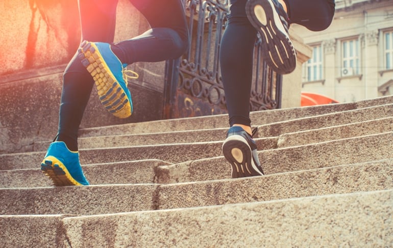 Couple running up stairs to demonstrate the effects of exercise on the immune system