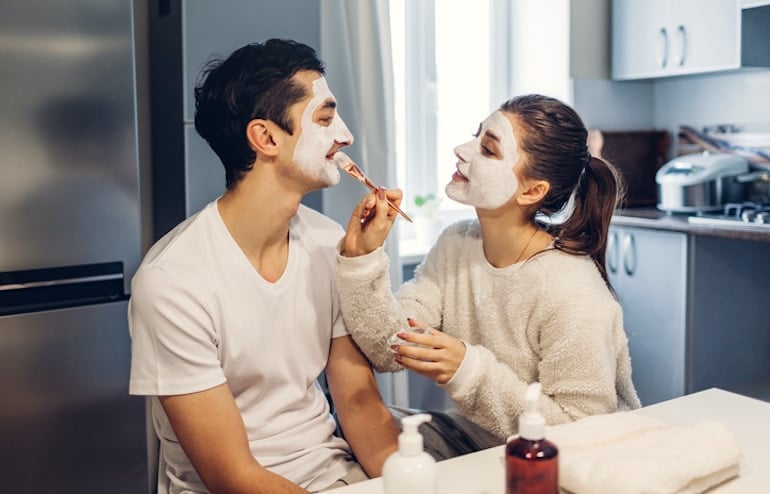 Couple applying homemade hydrating face masks to nourish winter dry skin