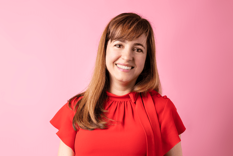 Sol de Janeiro Co-Founder Camila Pierotti in front of pink background