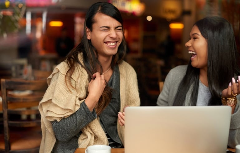 Friends laughing together at a cafe; count on those who value you