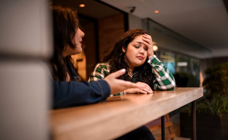 Woman ending a friendship at a bar because the relationship got toxic