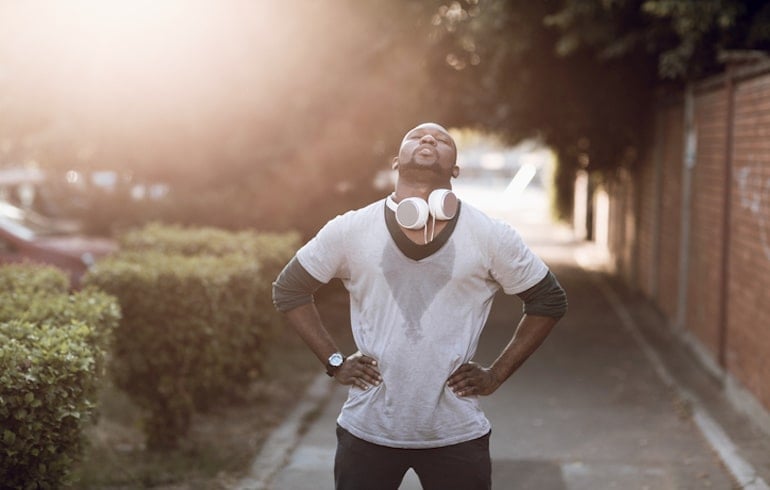 Man sweaty from a workout; high-intensity workouts can raise cortisol and stress