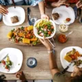 Overhead shot of Black nutrition experts sitting down for a healthy meal