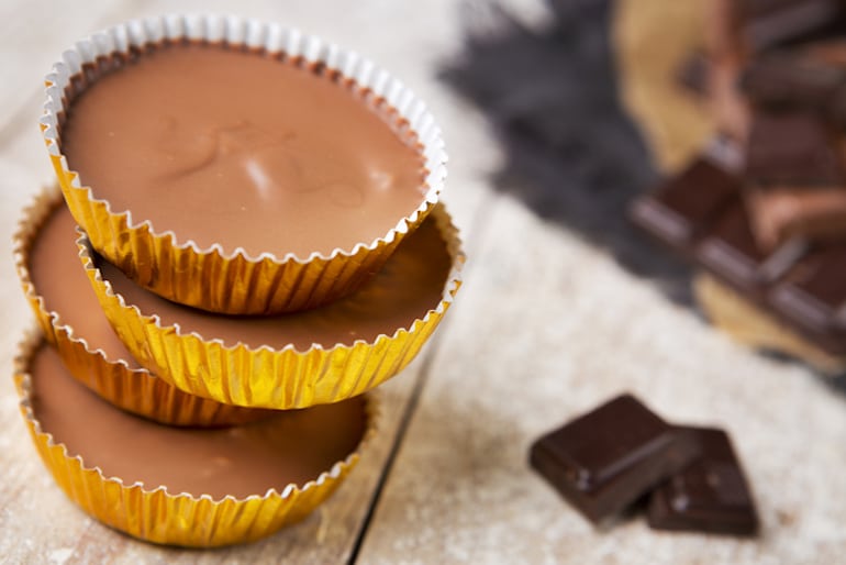 Chocolate peanut butter cups stacked up for dessert