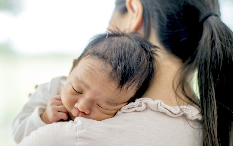 New mother holding newborn