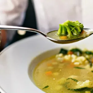 Eating soup with cruciferous vegetables as example of foods that are good for liver