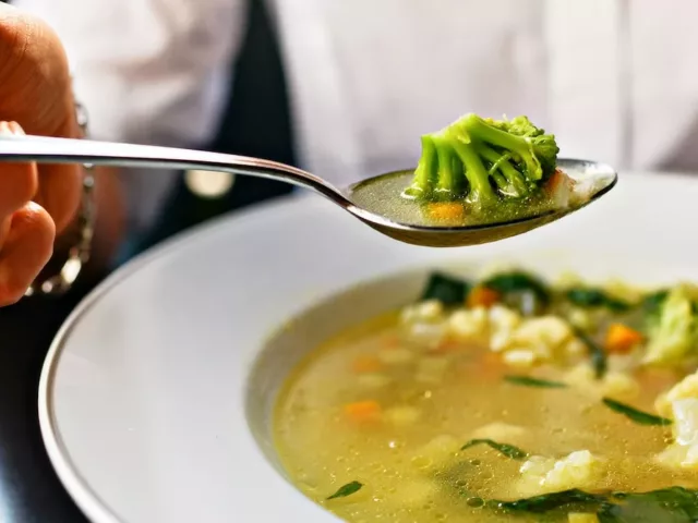 Eating soup with cruciferous vegetables as example of foods that are good for liver