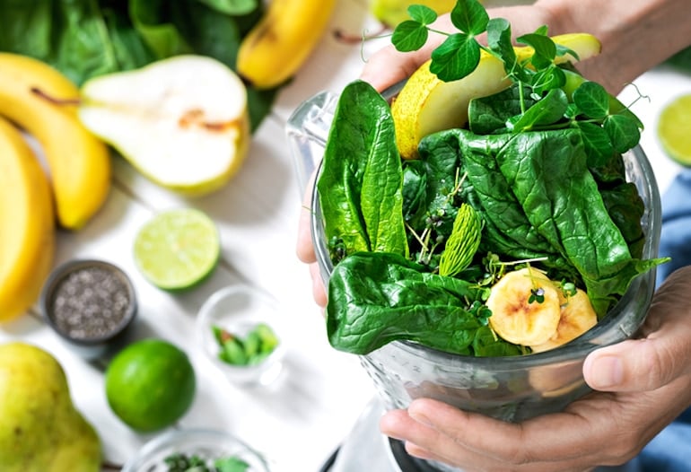 Packing a green smoothie with dark leafy greens and fruit