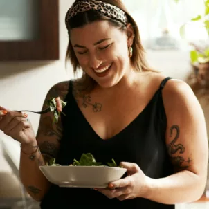 Woman eating low FODMAP foods to support digestive health