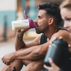 Man drinking protein shake after workout