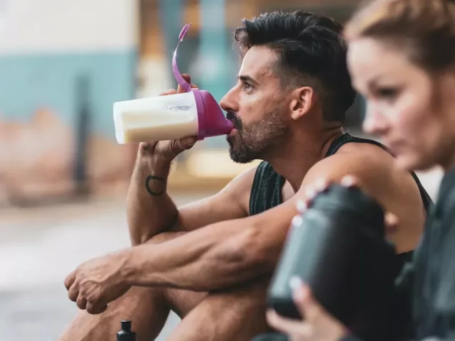 Man drinking protein shake after workout