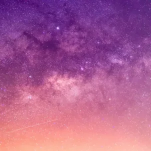 Purple, orange, and pink starry sky for astrology concept and April 2021 wellness horoscopes