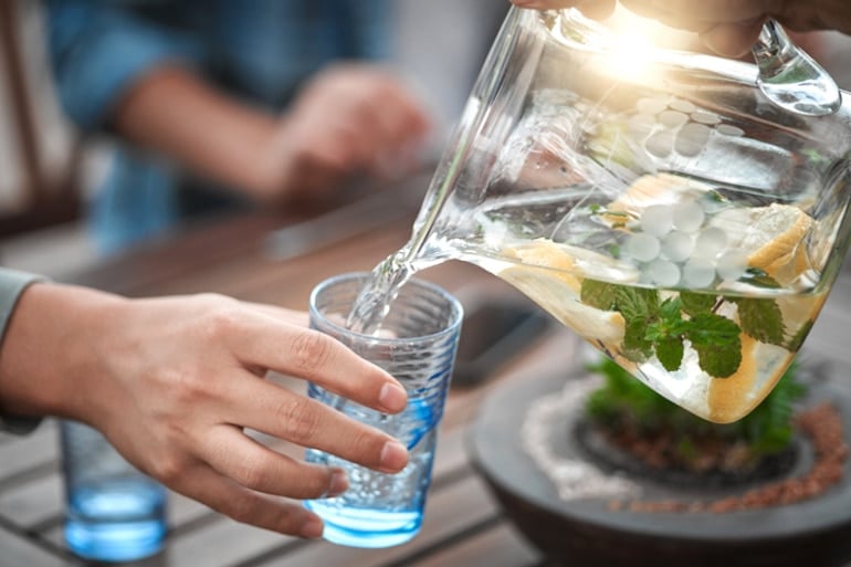 Pouring infused water into a glass