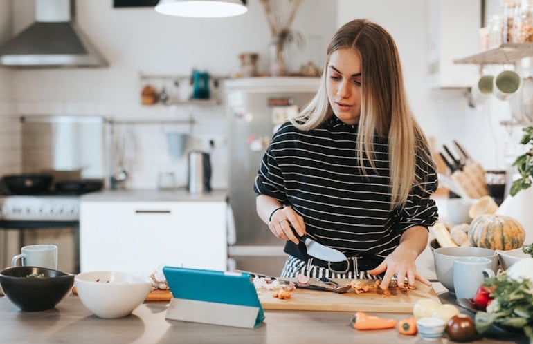 Young woman preparing a low-calorie meal on a weight loss regimen