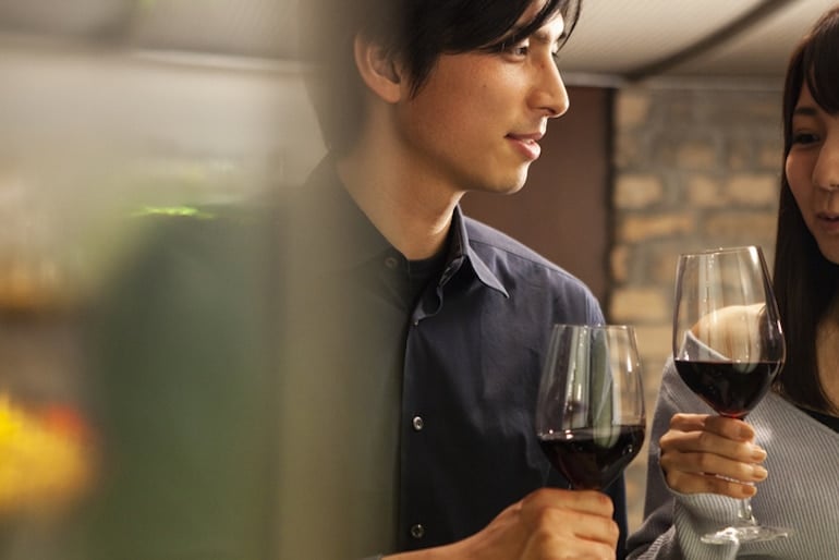 Couple drinking natural wine at a bar