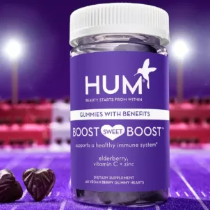 HUM Boost Sweet Boost immunity gummies on a purple football field