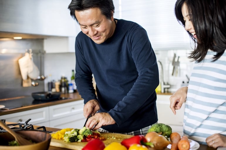 Couple preparing a plant-based meal in the kitchen