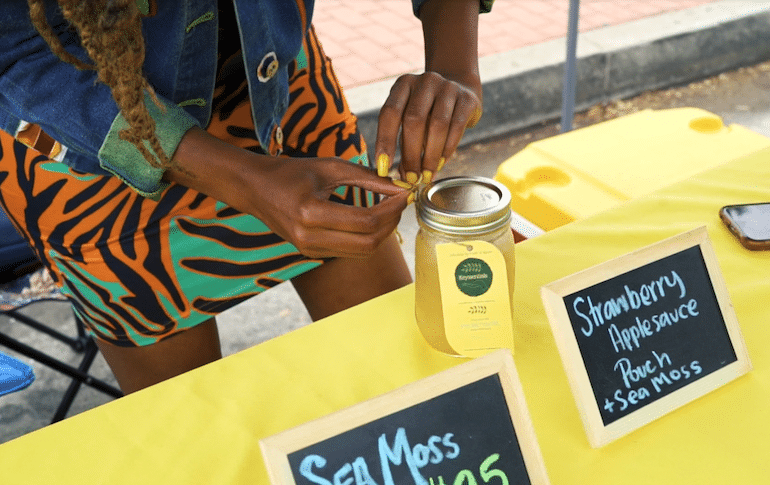 Woman selling fresh food at farmers market