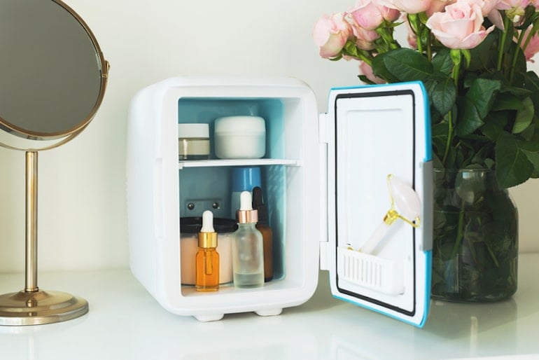 Makeup and other face products in a skincare fridge to prolong its shelf life