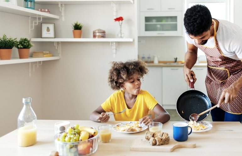 Father serving daughter the healthiest, best eggs for breakfast