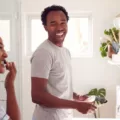 Couple brushing their teeth to prevent stains and yelllowing