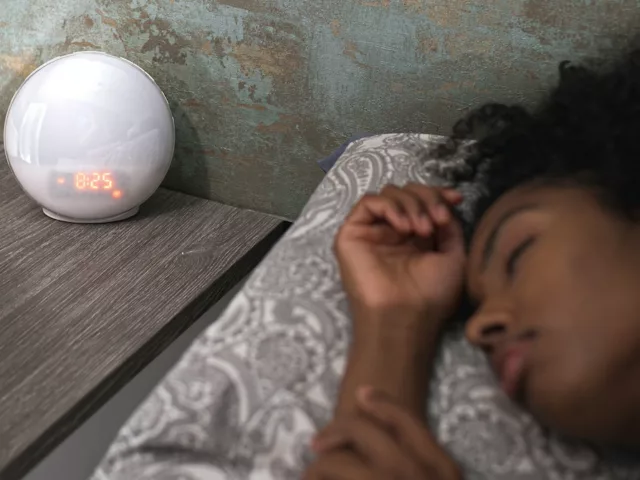 Woman sleeping early to boost her immune health