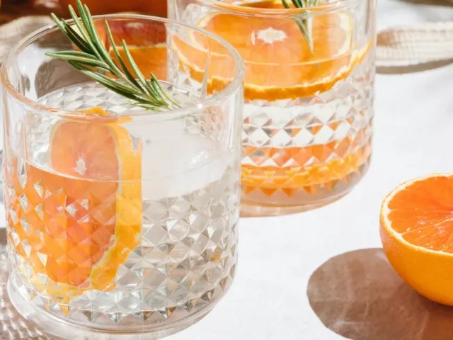 Healthiest hard seltzer in glasses with citrus fruits