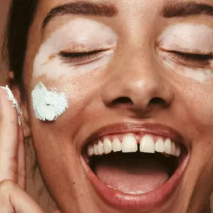 dehydrated skin vs dry skin woman applying cream