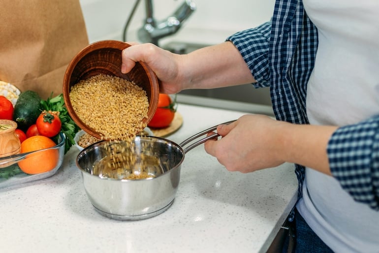 woman making ancient grains