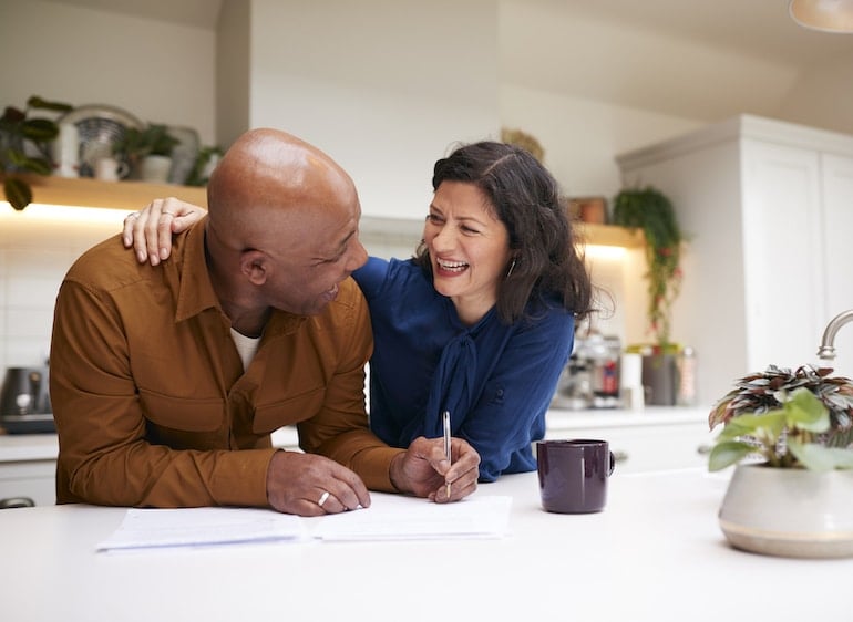 couple talking in kitchen