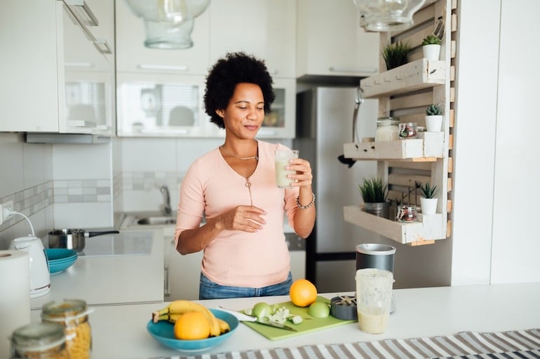 woman making a smoothie