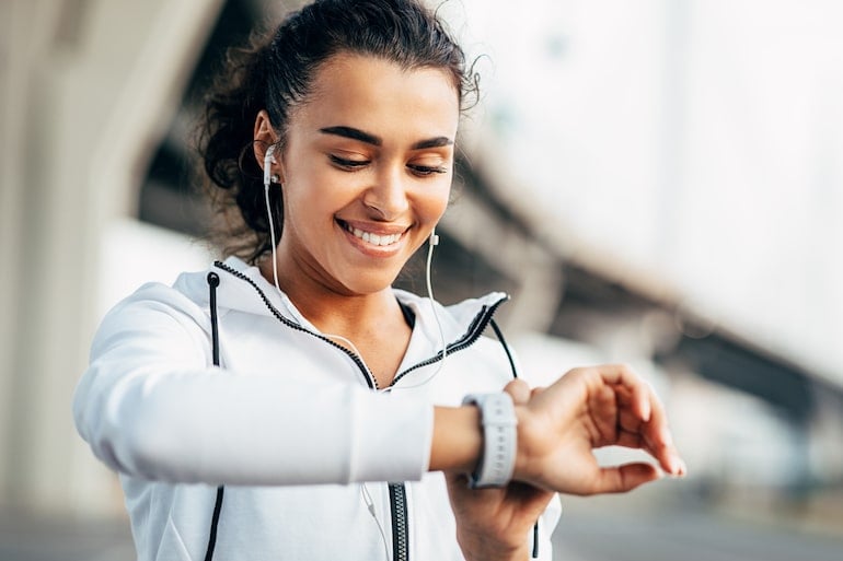 woman checking her fitness watch