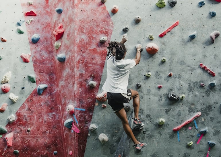 man rock climbing