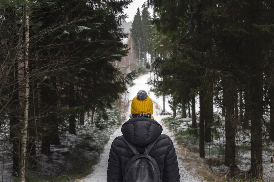 does cold weather make you sick woman walking through snow