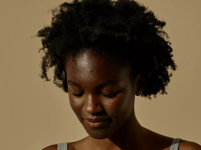 does sweat cause acne woman with forehead breakouts
