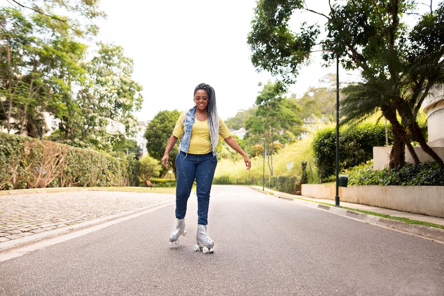 how to roller skate woman smiling in park