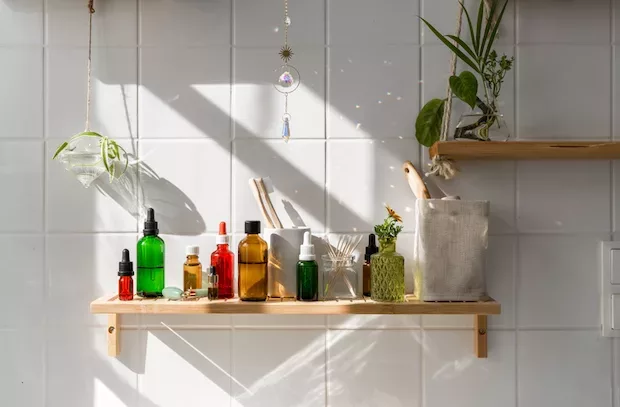 Minimalist skincare products on a bathroom shelf for an a.m. skin routine