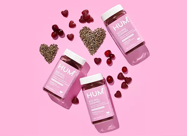 HUM Nutrition SOS PMS gummy supplement on a pink background