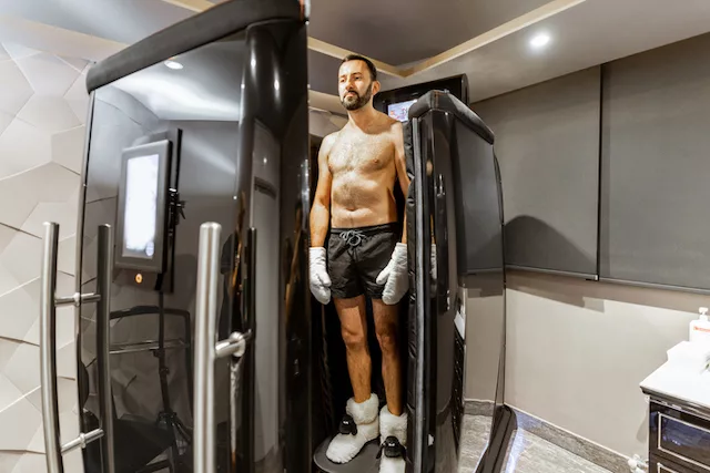 Biohacking man in a cryotherapy chamber