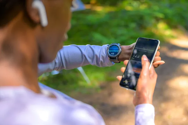 Woman tracking her health with biohacking device